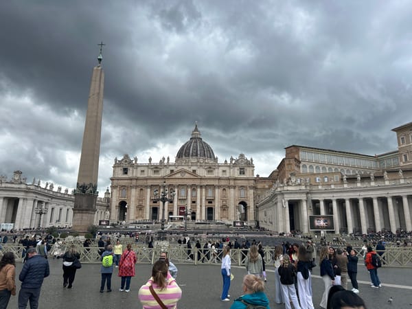 Crowds gather at Vatican's St. Peter's Square under grey skies