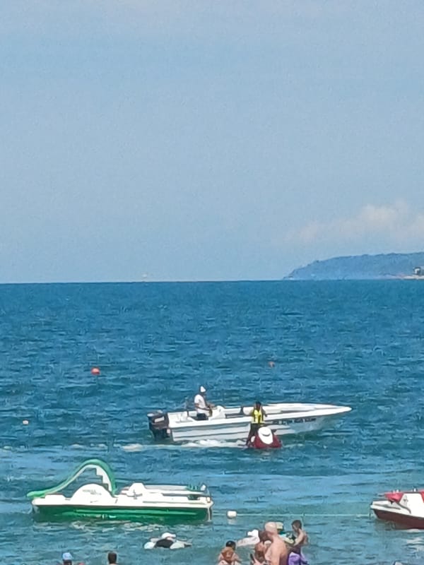 Sochi's Black Sea beach buzzing with boats and beachgoers