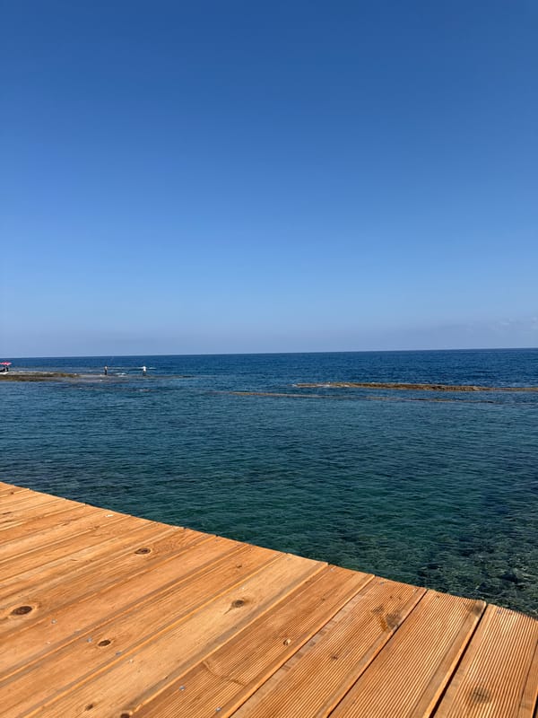 Wooden pier meets clear blue sea off Northern Cyprus coast
