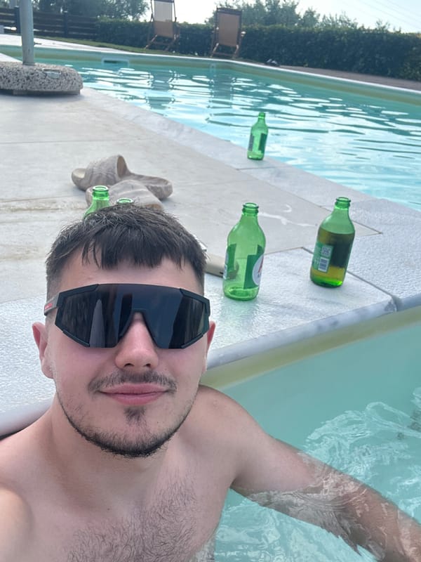 Quick poolside selfie session, sunglasses on, water everywhere.