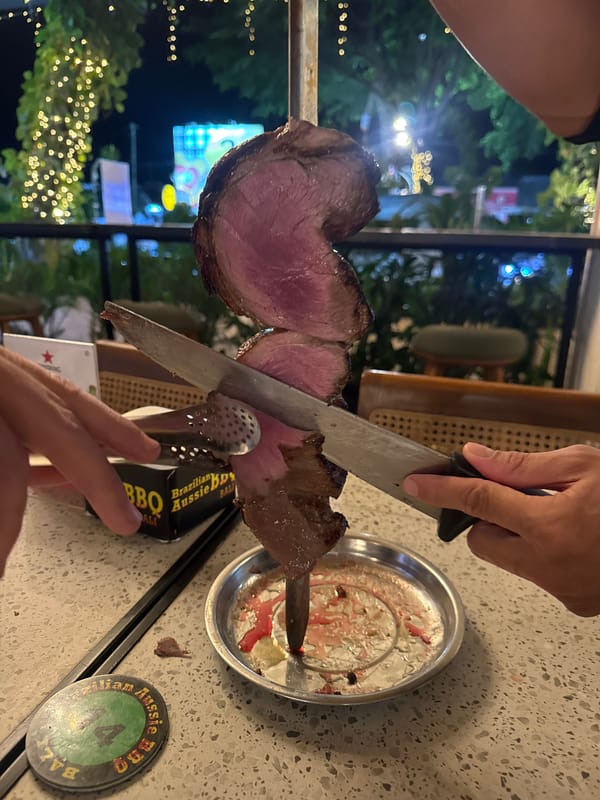 Lunch at a mural-lined Bali restaurant with tableside carved roast