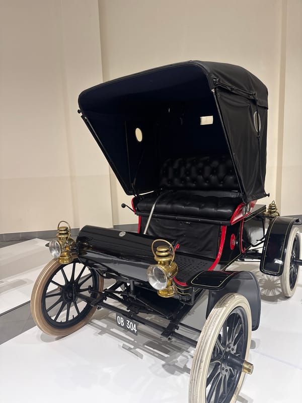 Visitors document vintage car museum exhibits in Stellenbosch