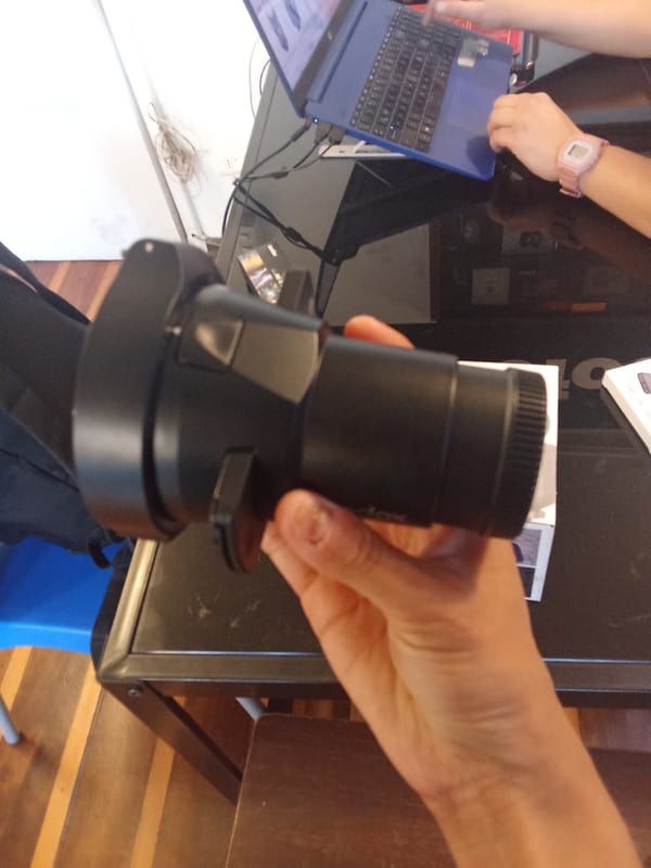 Person shops online for camera equipment in Santiago