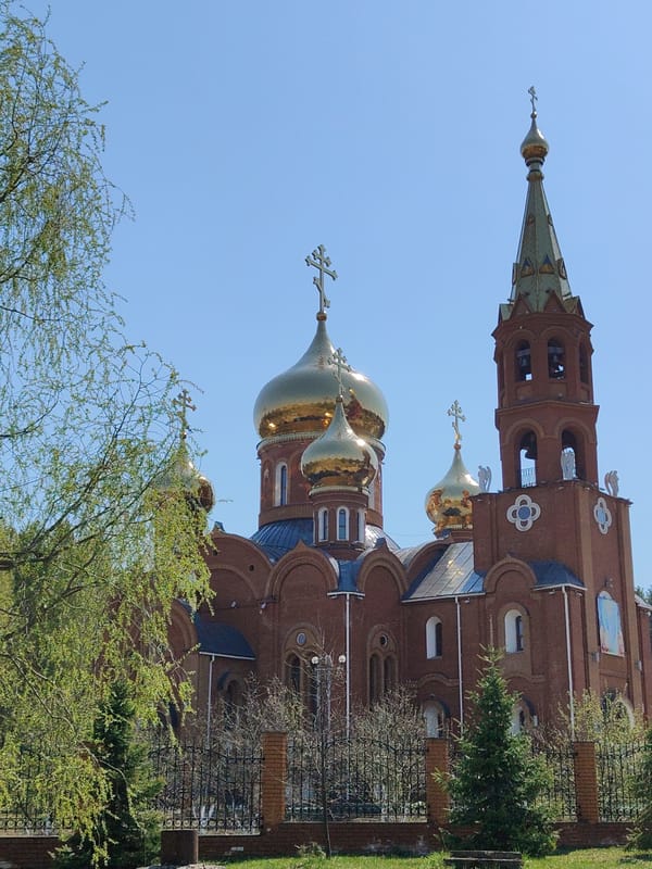 Orthodox Cathedral with Golden Domes Observed in Urban Setting