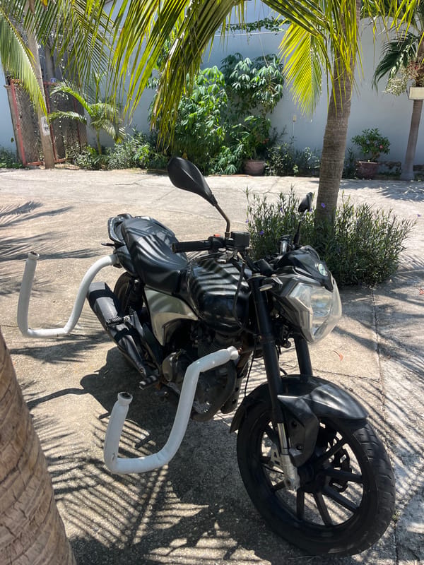 Motorcyclist's casual stops for drinks and currency exchange in Vietnam