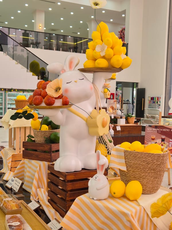 Whimsical bunny display inside a bright Da Nang bakery or cafe