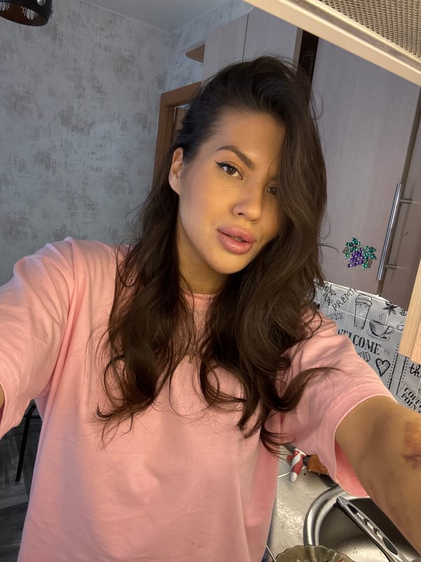 Woman takes kitchen selfies while cooking in Solnechnyy, Russia