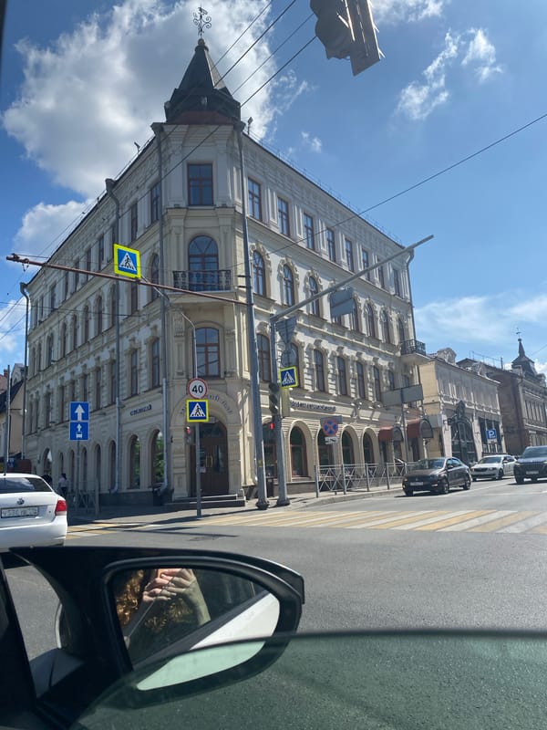 Sunny street views in Kazan featuring prominent buildings