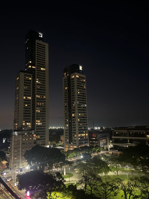 Nighttime view of lit apartment buildings captured in Buenos Aires