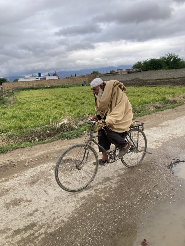 Elderly cyclist spotted on rural dirt road in Quetta