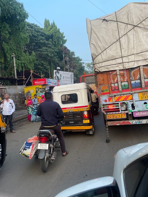 Cargo truck observed on busy Kolhapur street near commercial area
