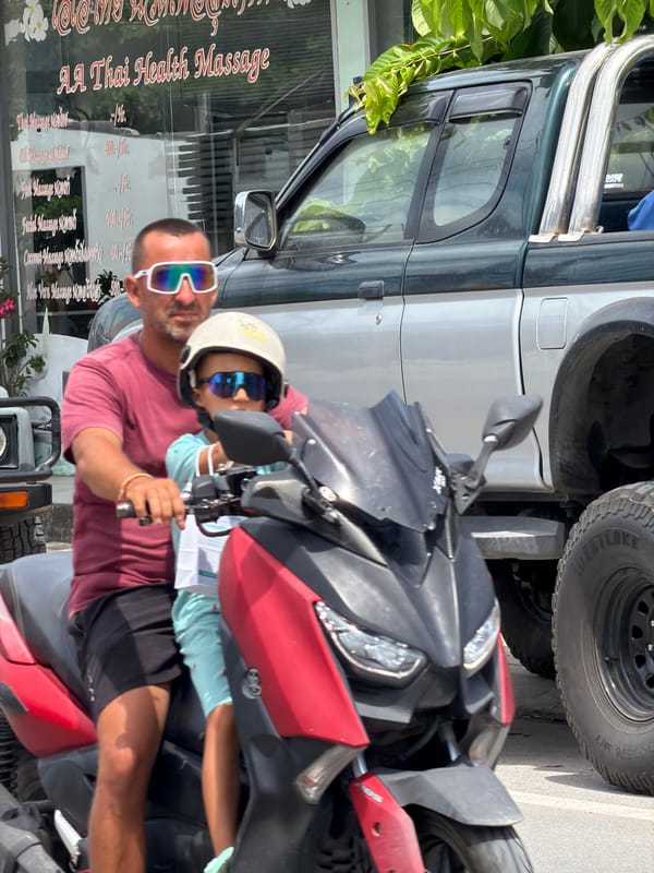 Scooter traffic flowing through Baan Bo Phut streets