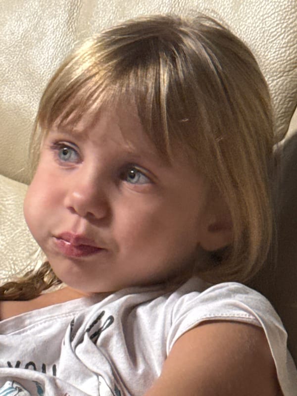 Quiet at-home moments with a child relaxing on the couch