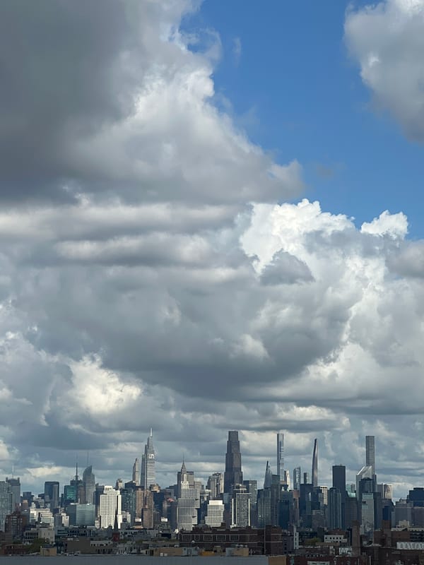 Manhattan skyline photographed under dramatic cloudy skies Friday afternoon