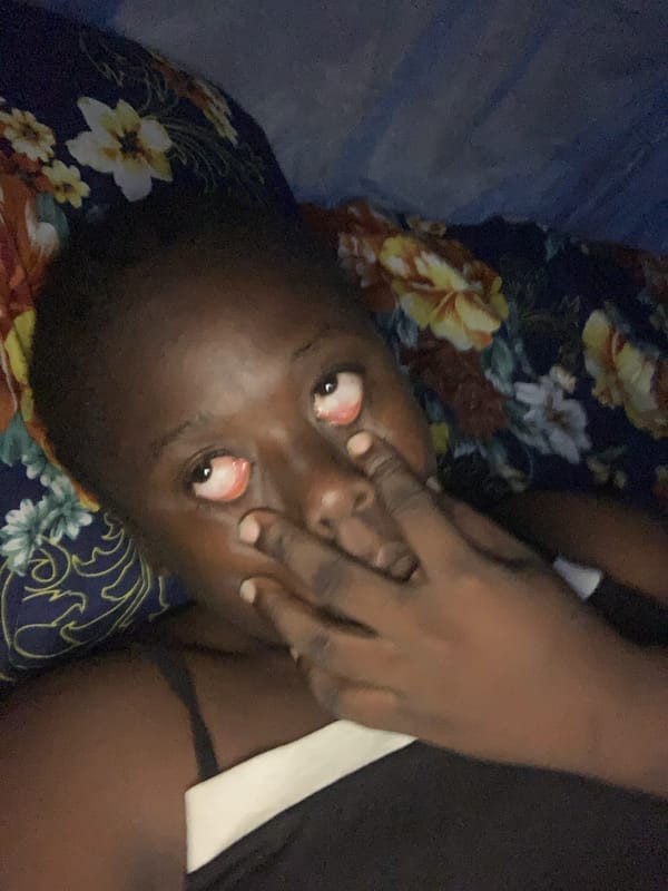 Person resting on floral fabric observed in Kukum, Nigeria