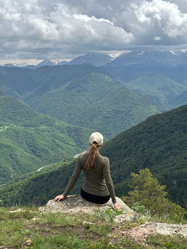 Tourists photograph mountain scenery at Russian Caucasus overlooks
