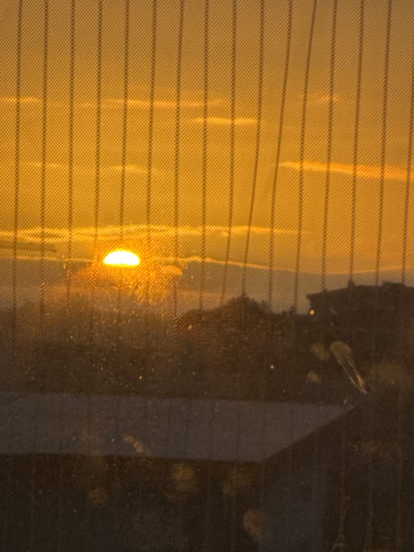 Dawn sunlight breaks through clouds over Figueira da Foz