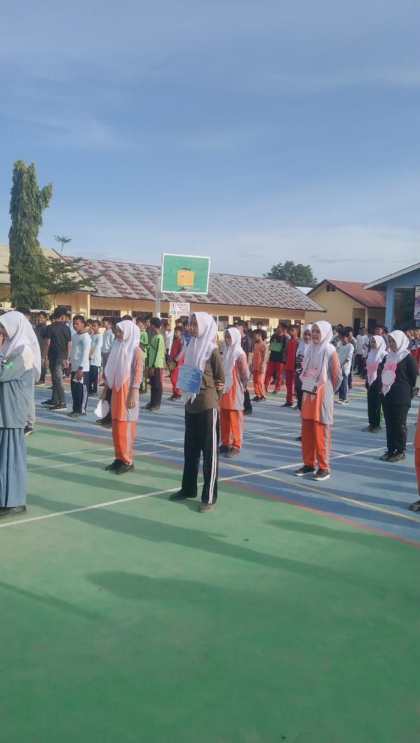 Students in formation on an outdoor court in Rhieng Blang
