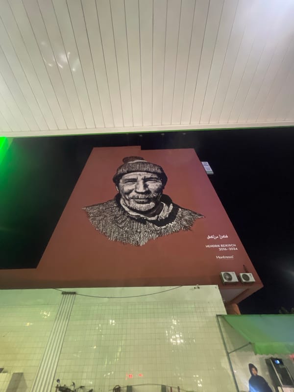 Street art and signage documented in nighttime Marrakesh