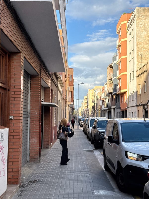 Person walks down narrow residential street in Badalona