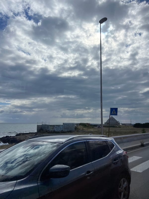 Morning coastal drive captured along Bari shoreline