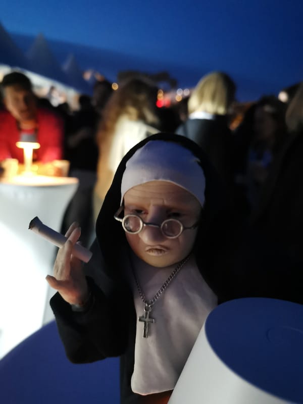 Nun-dressed doll with cigarette spotted at Cannes gatherings
