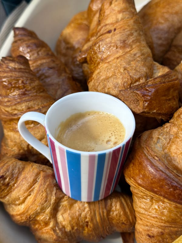 Morning coffee and croissants captured in Luxembourg breakfast scene