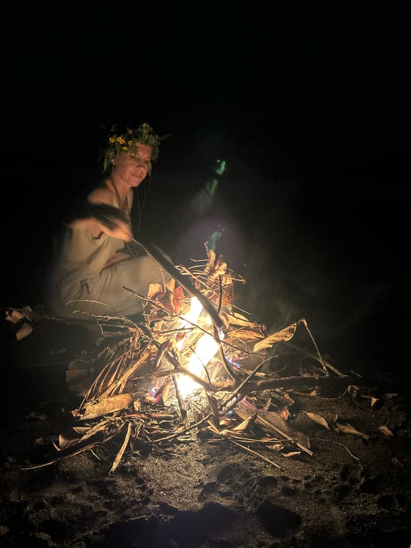 Nighttime beach bonfire gathering in Kediri, Indonesia