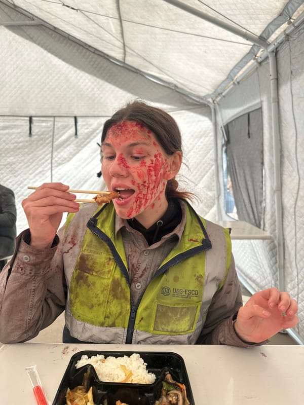 Person eats meal in temporary tent, Huangdao District
