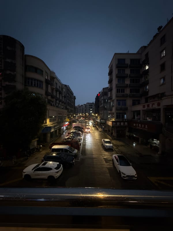 Rainy evening scooter scene captured in Yiwu, China