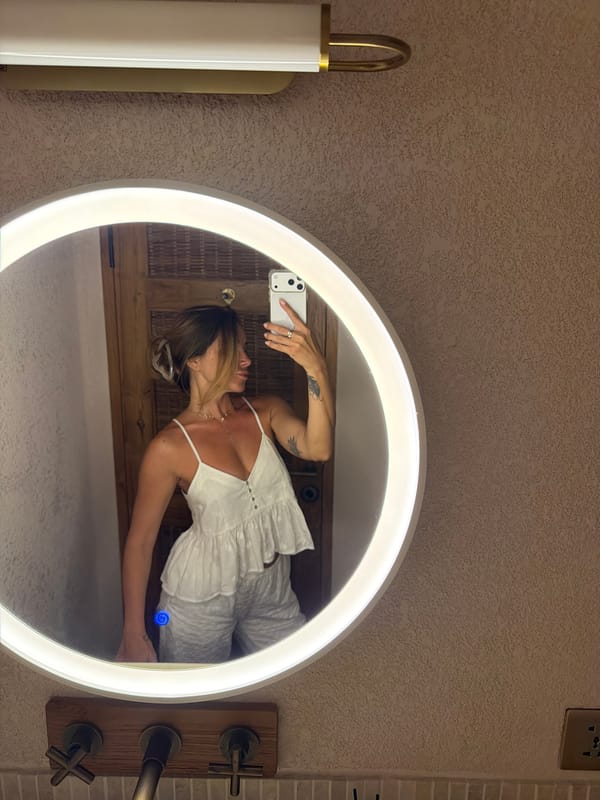 Mirror selfies in a Bali bathroom, white outfit, LED mirror