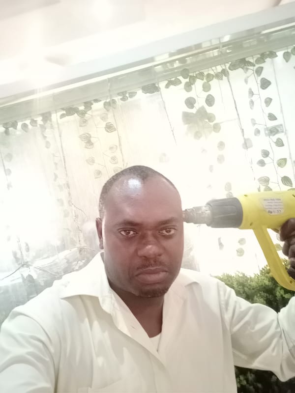 Man poses for multiple photos during afternoon in Gwarinpa
