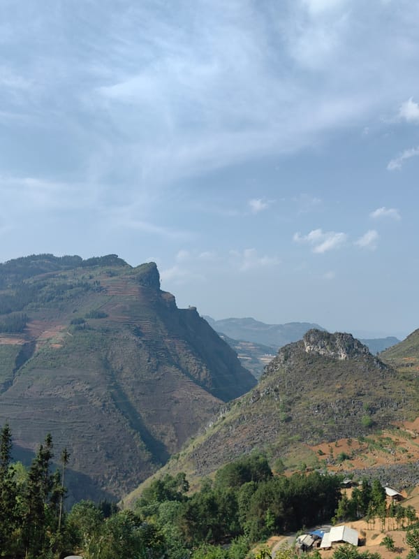 Morning traffic flows through terraced mountains in Đồng Văn