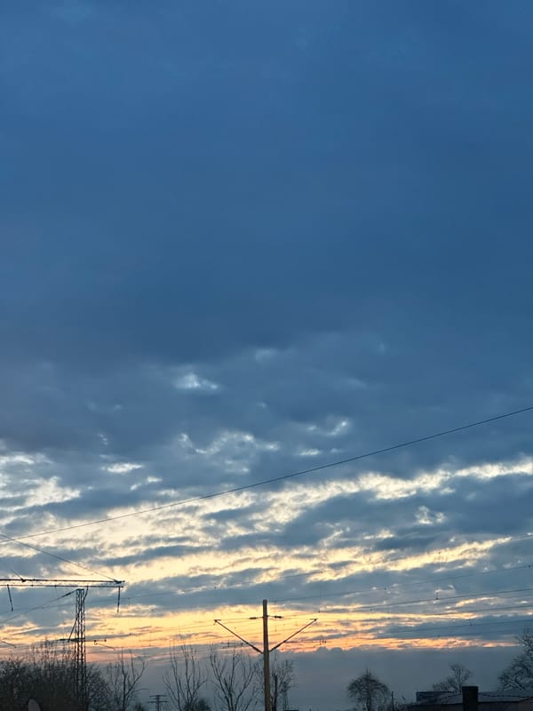 Horizontal cloud formations align with power lines in Bulgaria