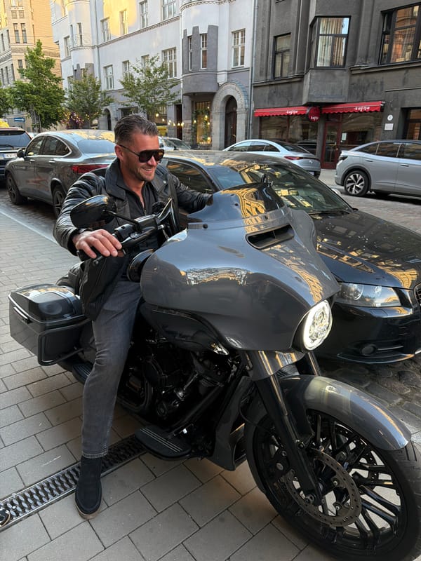 Motorcyclist enjoys afternoon refreshments in Riga