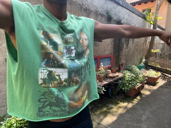 Person spotted in sunlit Milan courtyard Friday morning