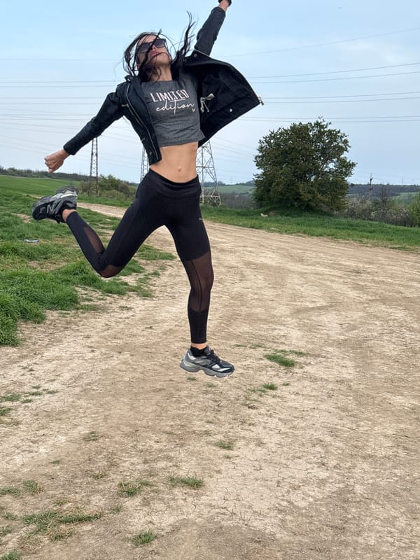 Woman photographed in dynamic outdoor poses in Pleven field