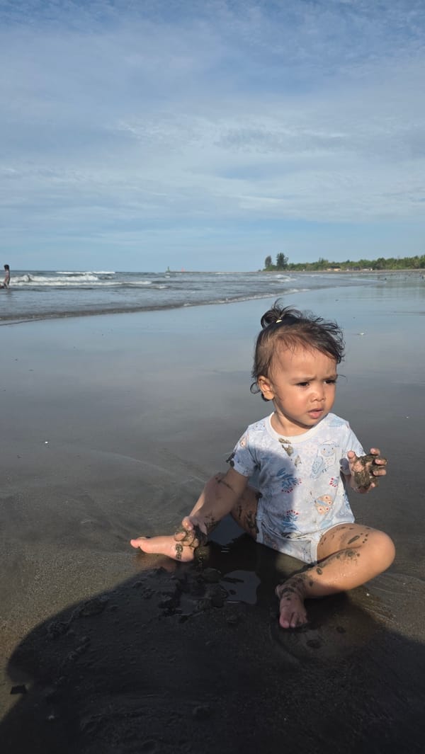 Child plays, crabs scuttle across Indonesian beaches Sunday morning
