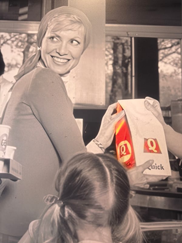 Woman and child photographed with Quick food in Paris