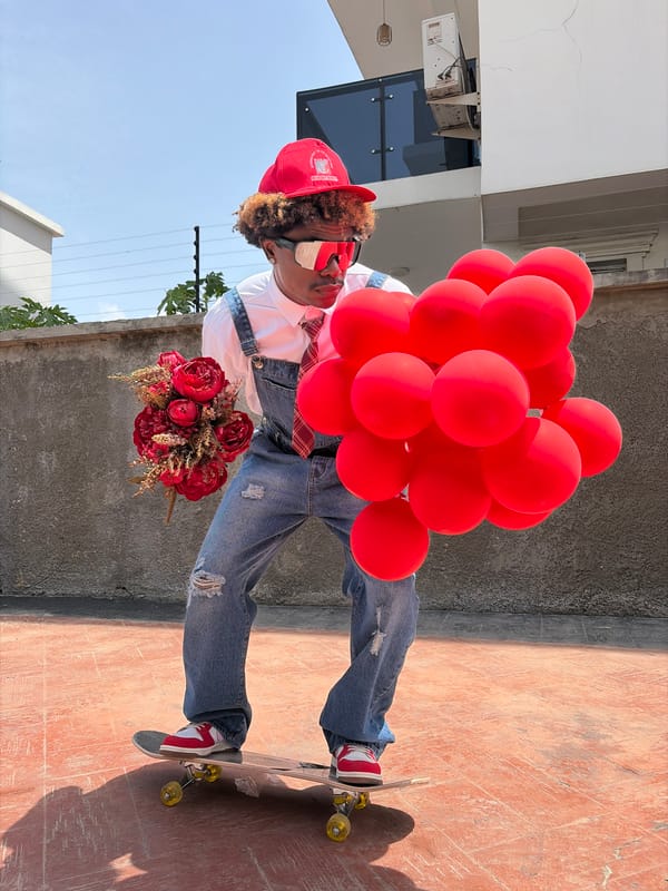Man on skateboard holds balloons, flowers in Nigeria