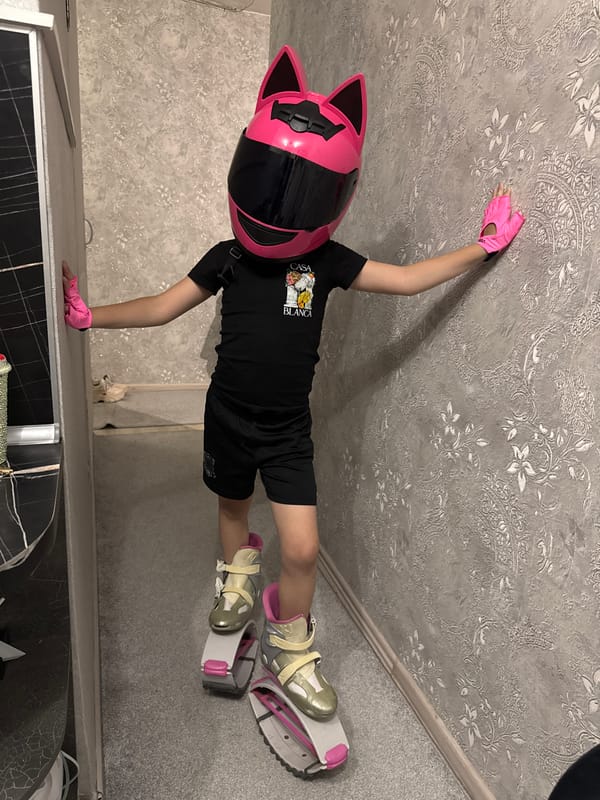 Child performs indoor gymnastics routine in Abakan home