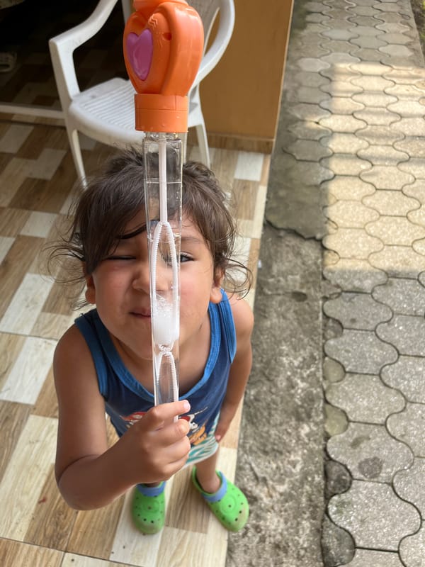 Bubble-blowing on a sunny patio in Kobuleti, Georgia