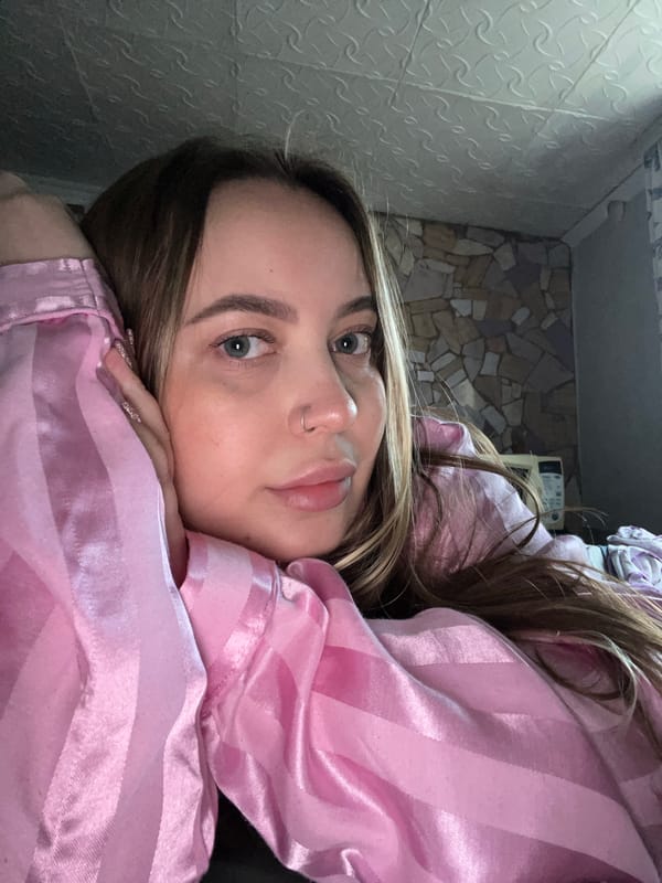 Woman in pink jacket photographed during spring day in Russia