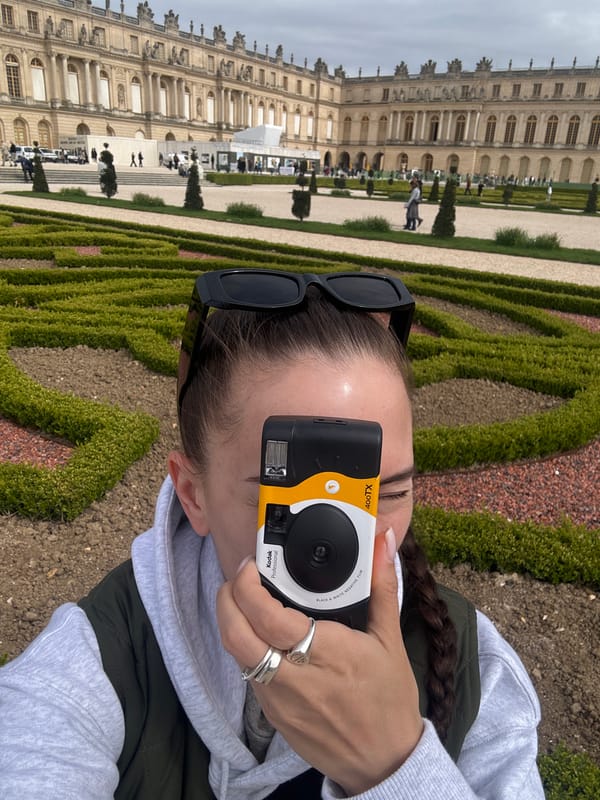 Tourist captures Palace of Versailles with vintage Kodak camera