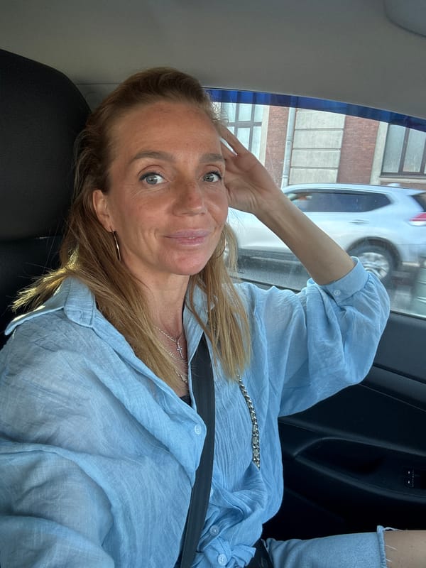 Goofing around in a car near Smolny Cathedral, Saint Petersburg