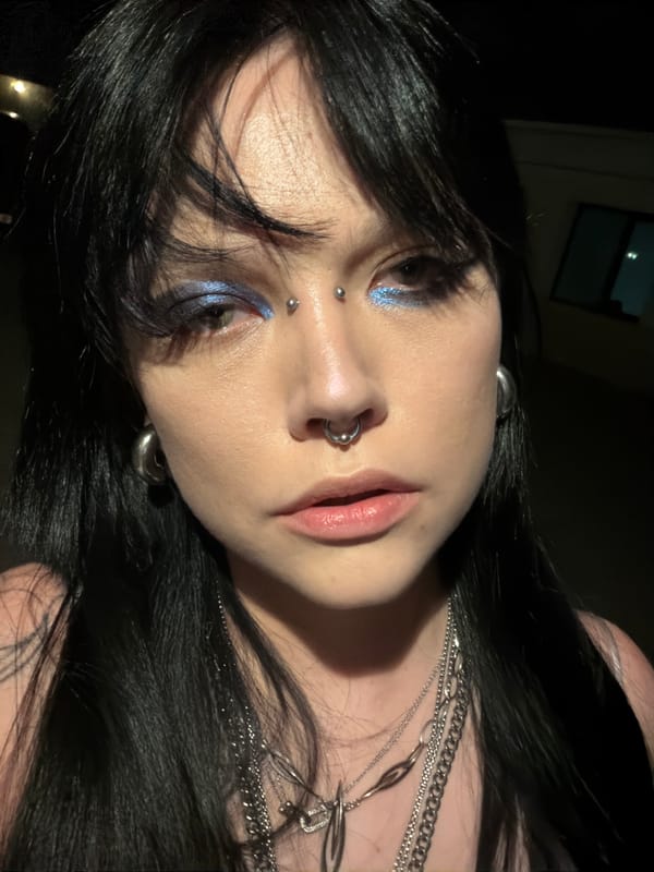 Late-night selfie series, facial piercings and layered silver necklaces