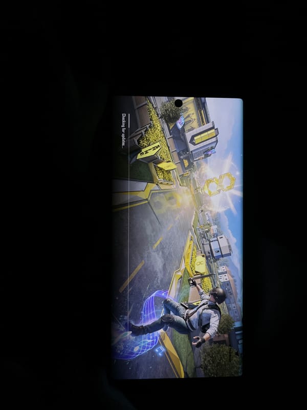Mobile gaming session captured in darkened Uitenhage environment