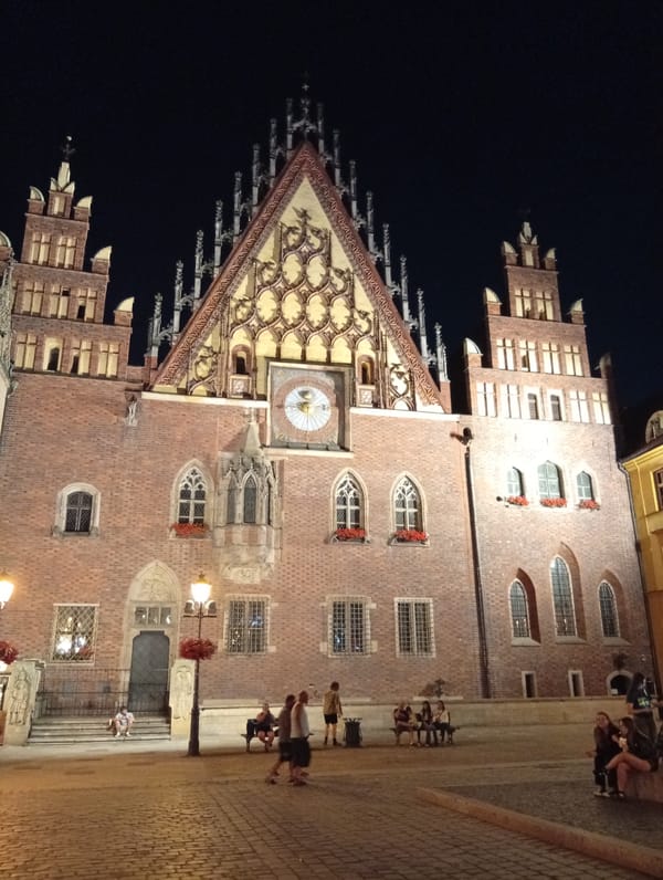 Handpan music outside Wrocław's Gothic Old Town Hall at night
