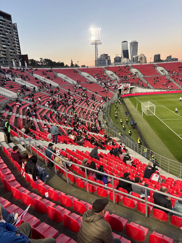 Football stadium activity captured in Tbilisi during evening hours