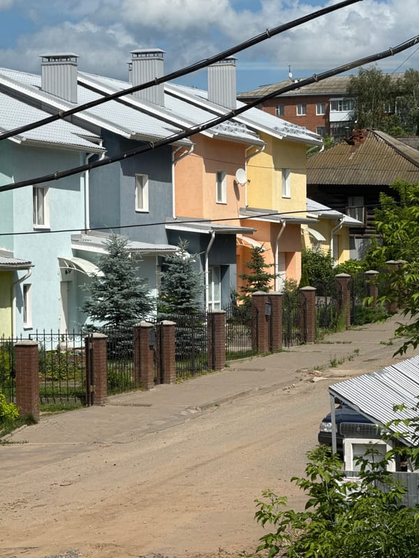 Street-level look at Votkinsk's residential neighborhoods on a summer morning